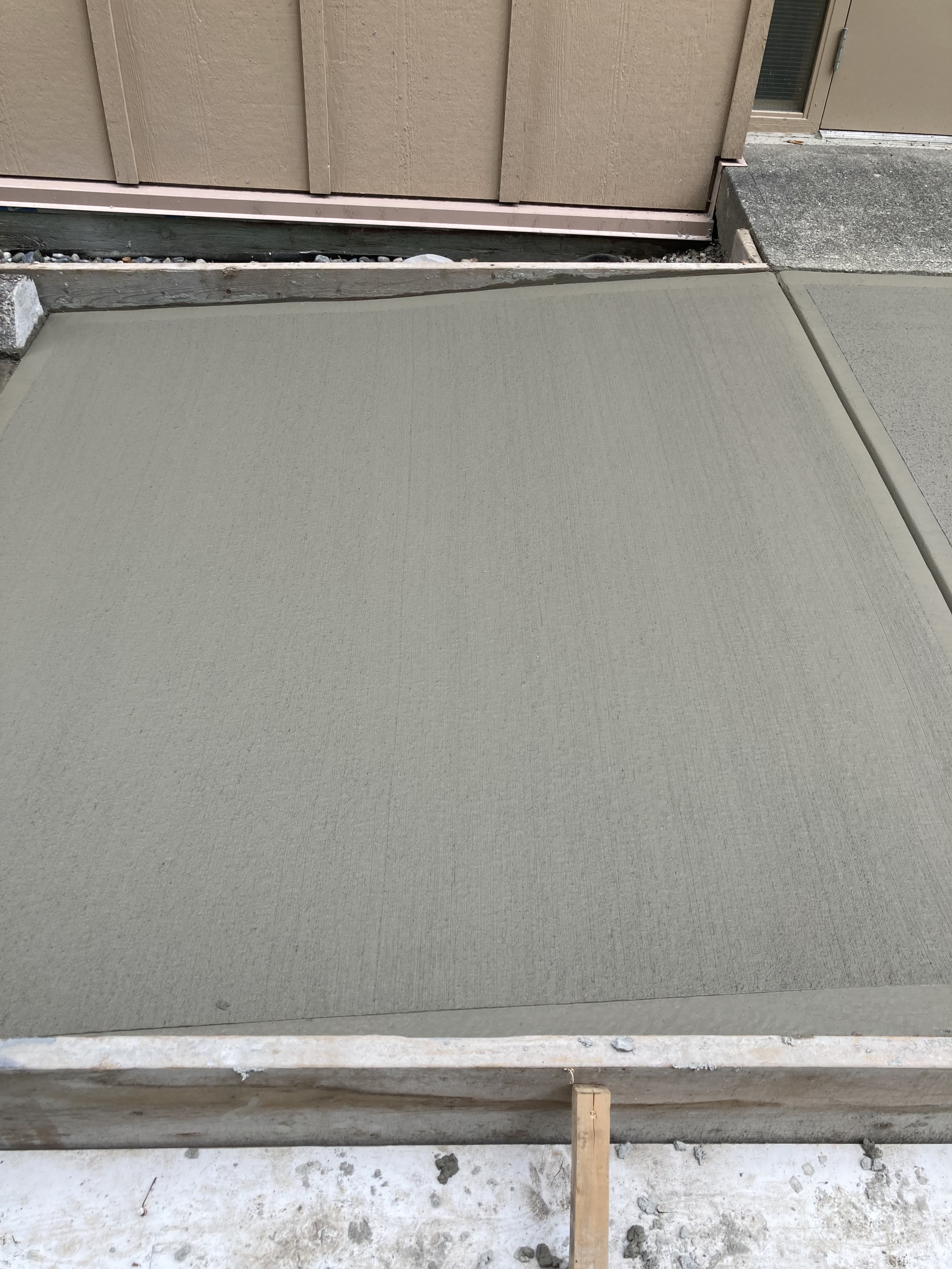Freshly poured concrete walkway by JFK Surfaces near Rocky Mountain House, Alberta