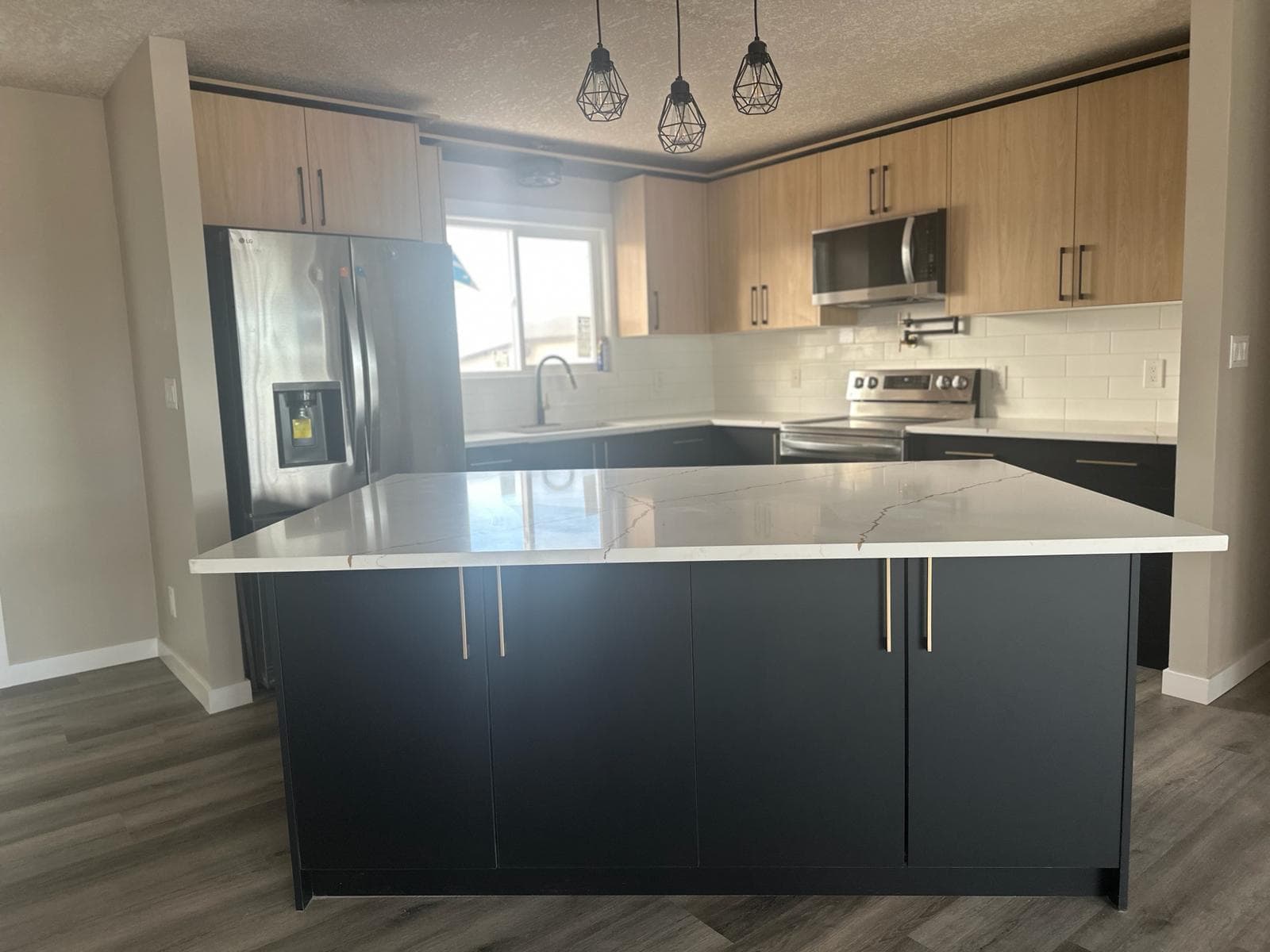 Navy & light-wood two-tone — JFK Surfaces project in Central Alberta