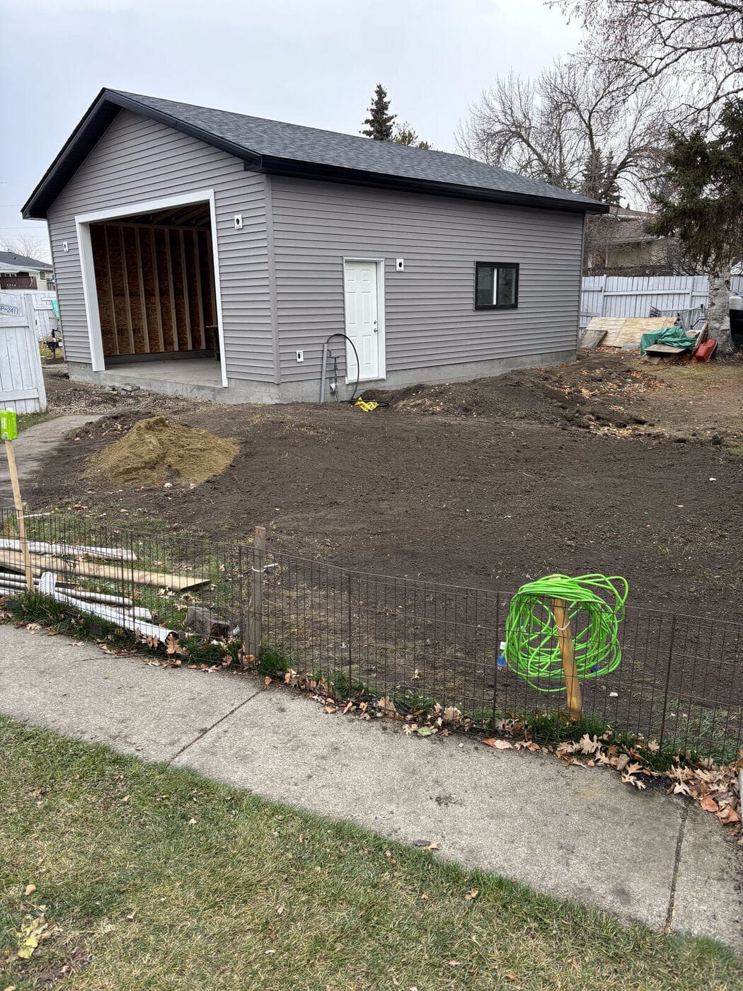 Garage with new concrete pad — JFK Surfaces in Central Alberta