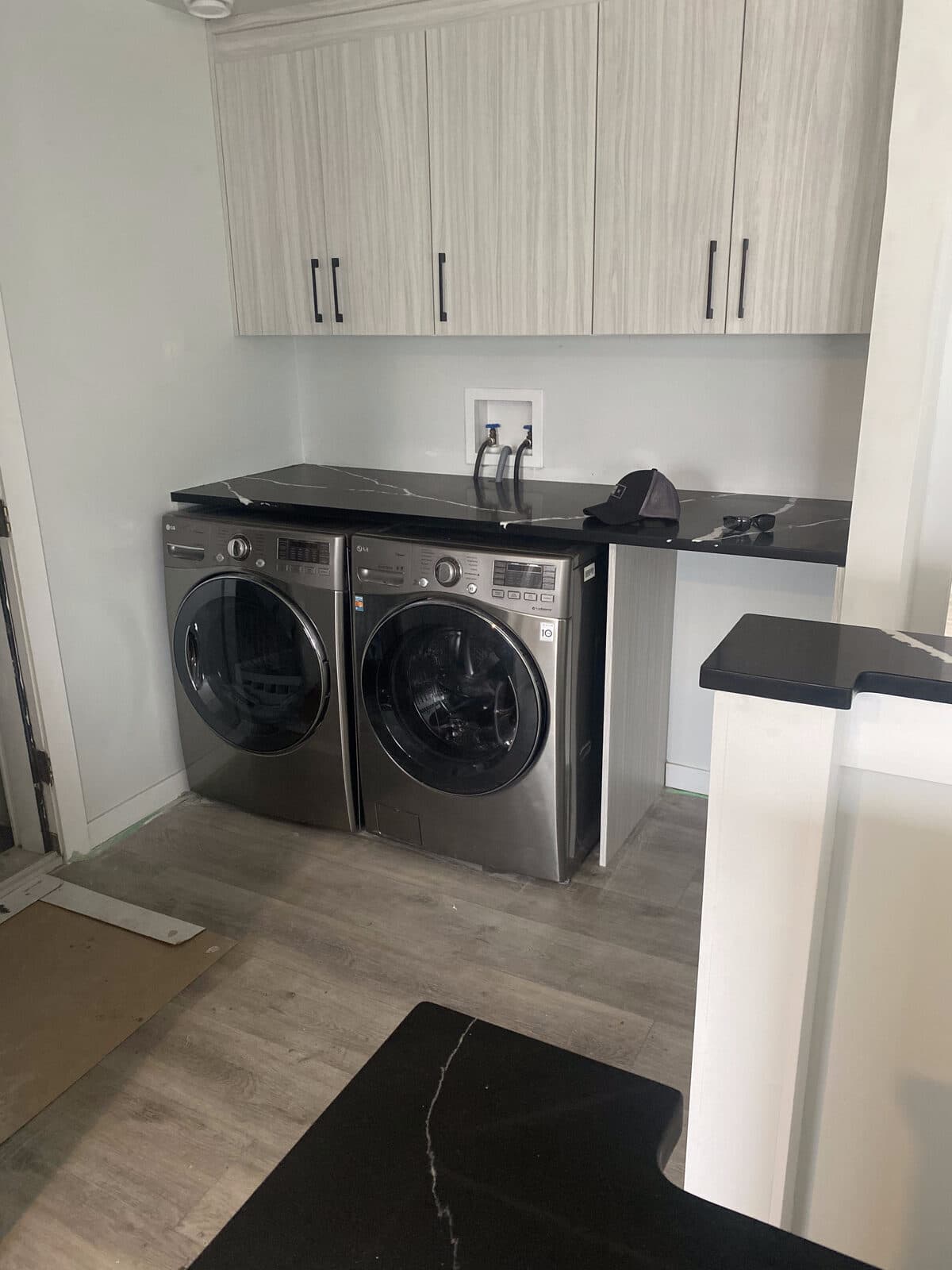 Modern laundry room — JFK Surfaces project in Central Alberta