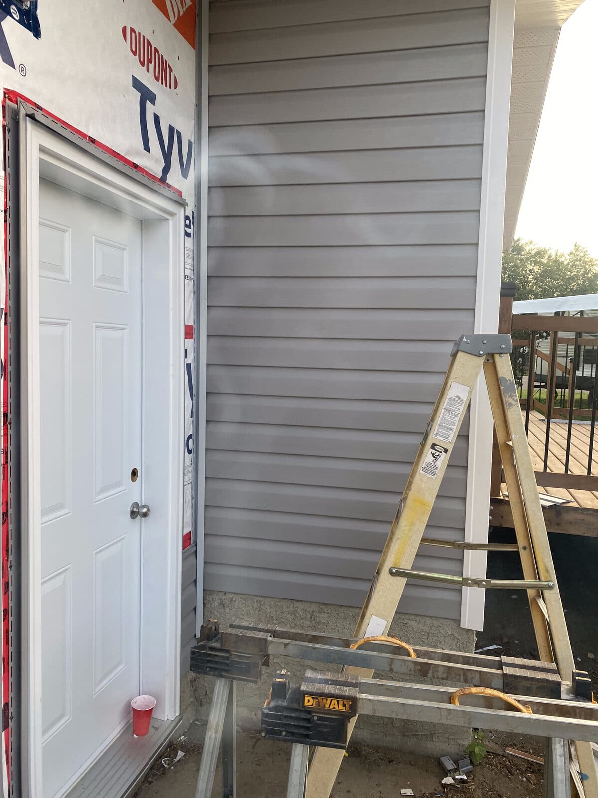 Gray horizontal siding install — JFK Surfaces project in Central Alberta