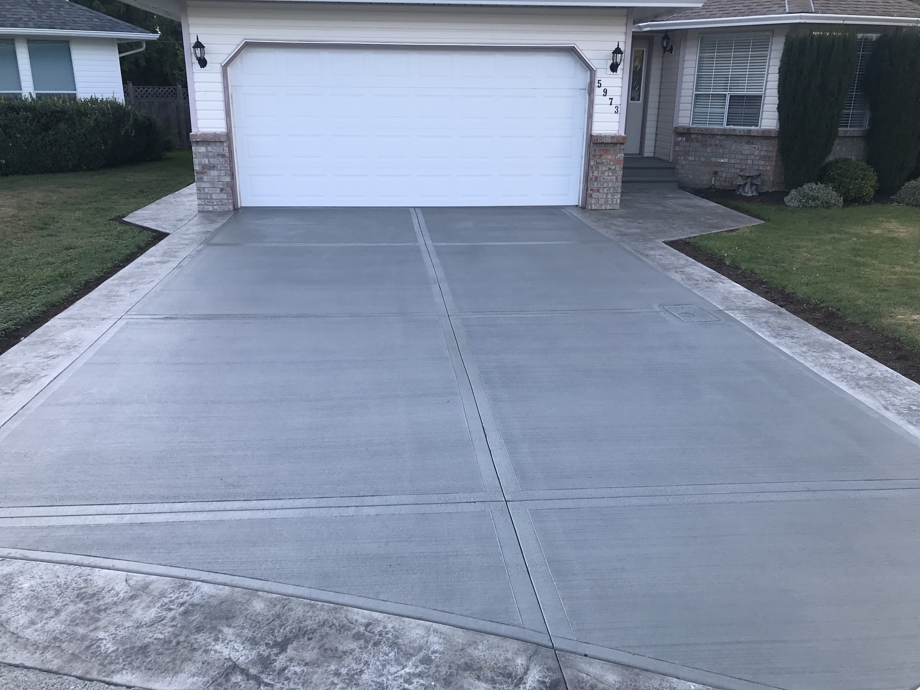 Long acreage driveway poured by JFK Surfaces near Ponoka, Alberta