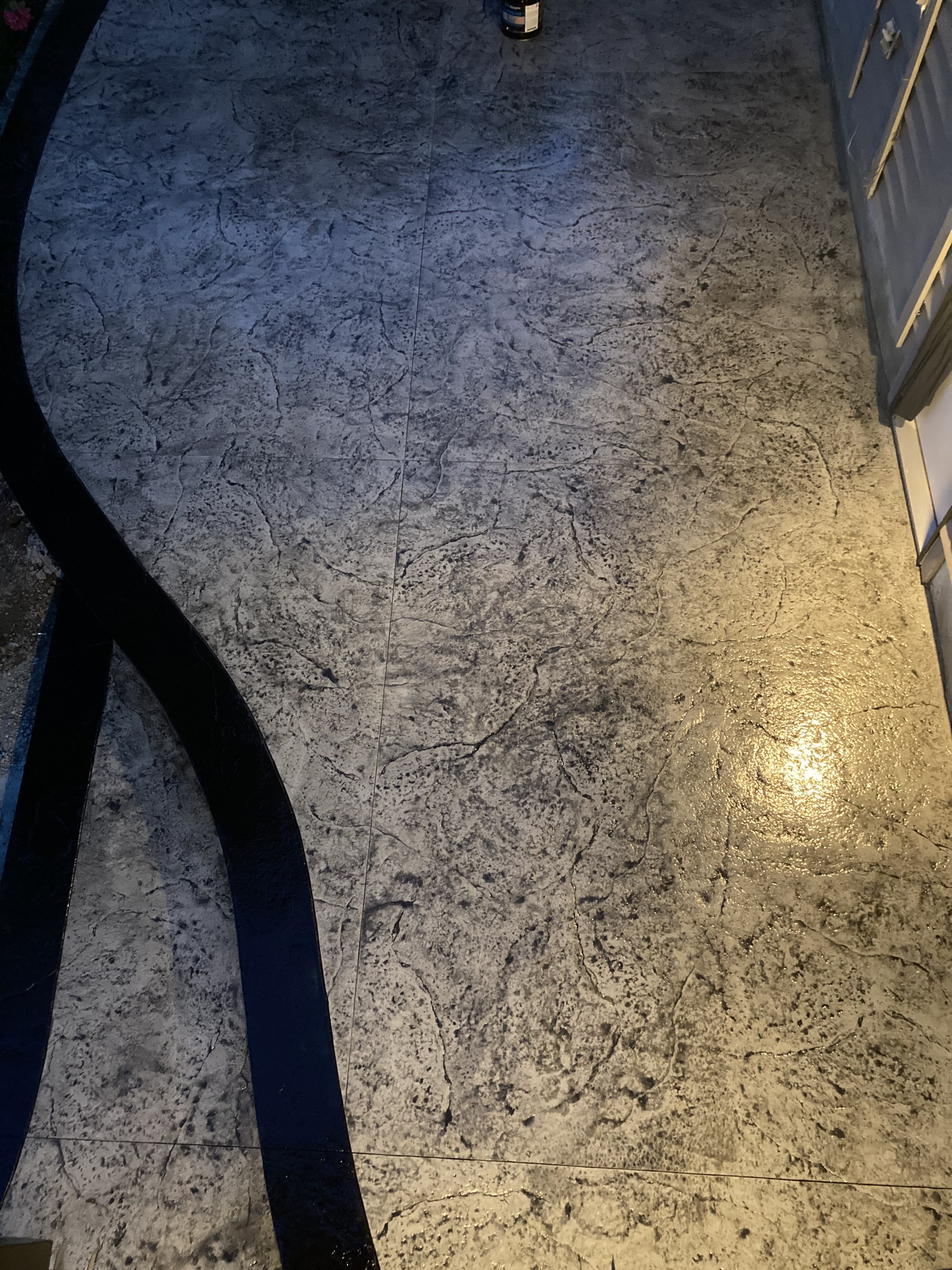 Stamped decorative concrete finished by JFK Surfaces in Red Deer, Alberta